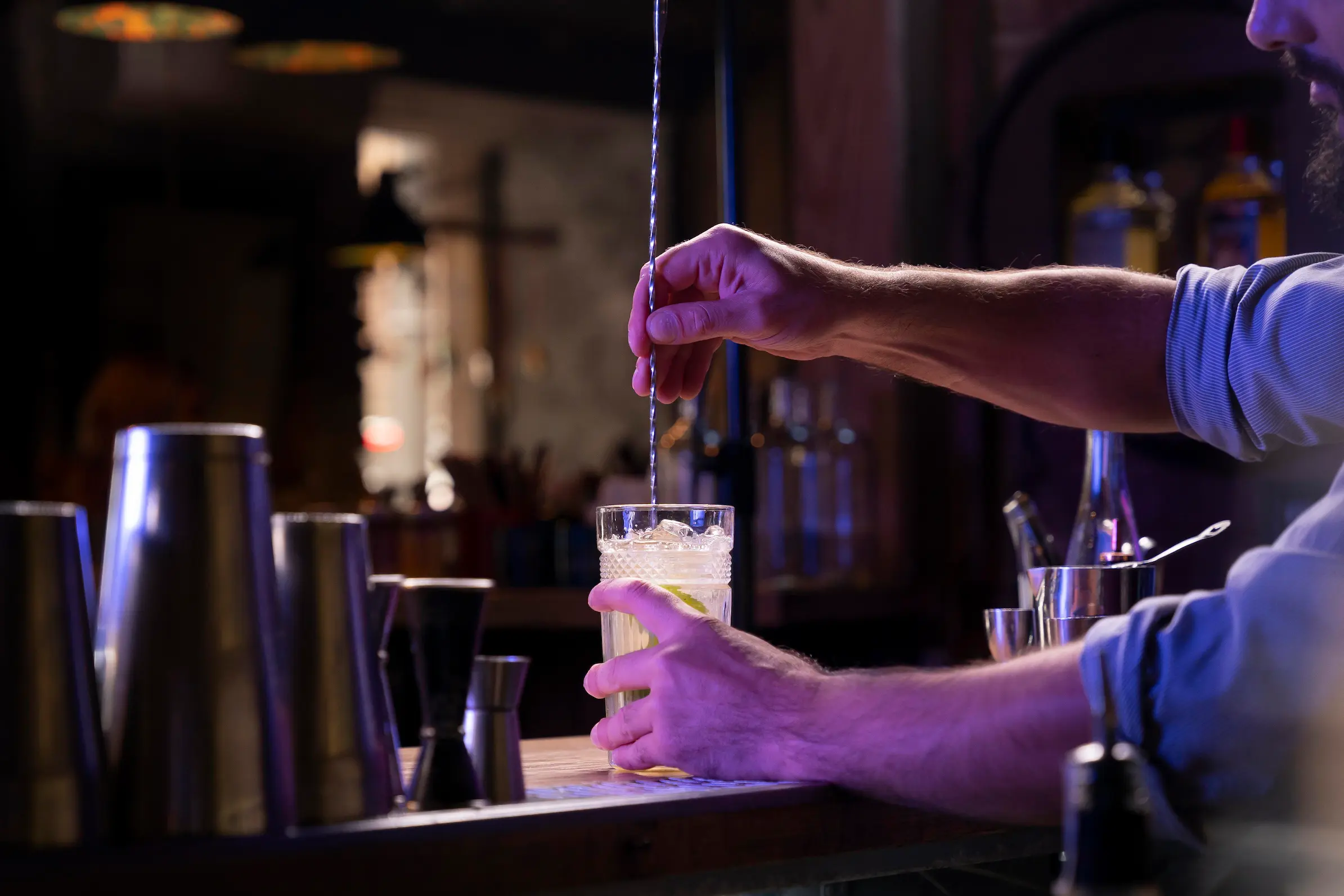 Professional bartender preparing cocktails at a wedding bar